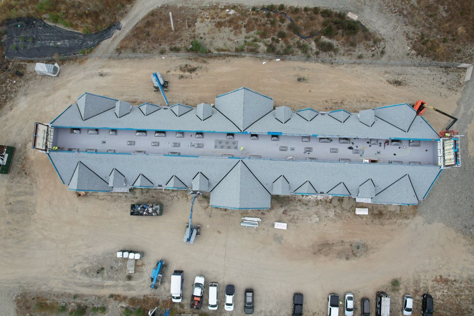 60 mil Mule-Hide TPO membrane over tapered ISO insulation on a low-slope roof section at a Bothell college preparatory school
