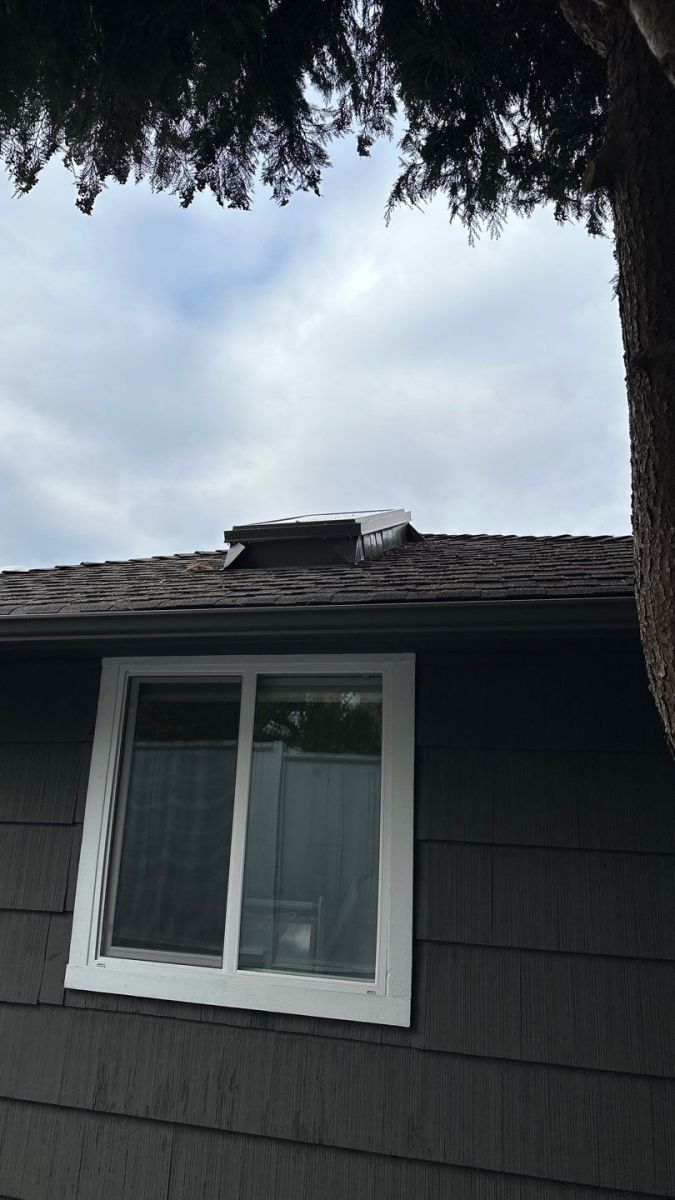 Velux skylight with integrated shade installed during a Mill Creek roof maintenance visit